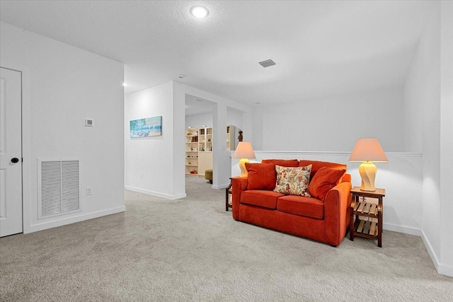 821 NE Trailside Run, Port Saint Lucie, FL 34983 - living area featuring carpet flooring, baseboards, and recessed lighting
