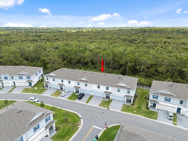 821 NE Trailside Run, Port Saint Lucie, FL 34983 - aerial perspective of suburban area featuring a forest