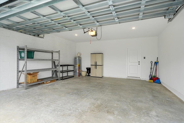 821 NE Trailside Run, Port Saint Lucie, FL 34983 - garage with water heater, a garage door opener, and recessed lighting