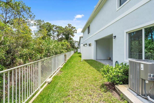 821 NE Trailside Run, Port Saint Lucie, FL 34983 - view of yard with central AC