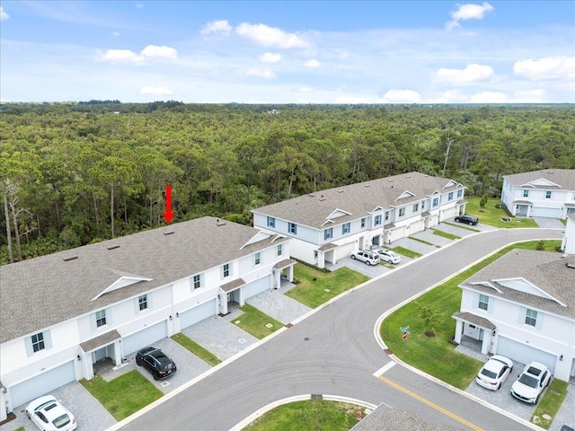 821 NE Trailside Run, Port Saint Lucie, FL 34983 - aerial perspective of suburban area featuring a heavily wooded area