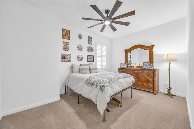 1246 Tangled Orchard Trce, Loxahatchee, FL 33470 - bedroom featuring light carpet, baseboards, and a ceiling fan