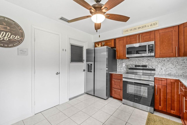 4260 Mango Tree Ct Unit B, Boynton Beach, FL 33436 - kitchen with stainless steel appliances, a ceiling fan, tasteful backsplash, and light stone countertops
