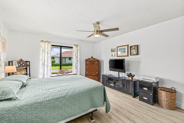 4260 Mango Tree Ct Unit B, Boynton Beach, FL 33436 - bedroom featuring light wood finished floors, a textured ceiling, and ceiling fan