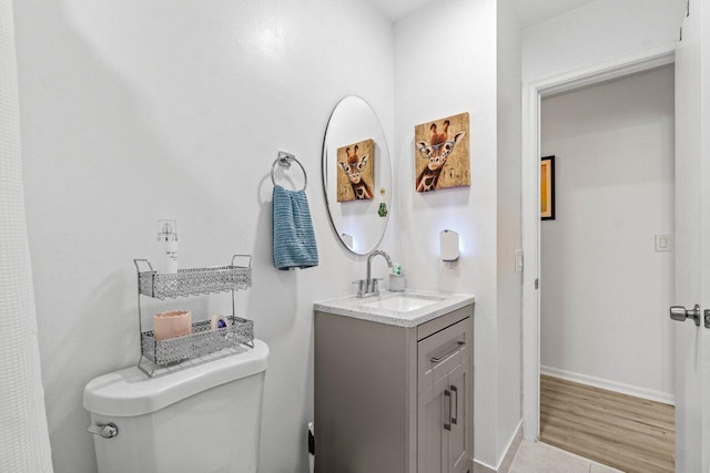 4260 Mango Tree Ct Unit B, Boynton Beach, FL 33436 - bathroom with toilet, vanity, baseboards, and wood finished floors