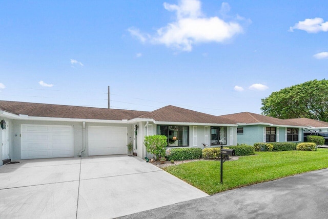 4260 Mango Tree Ct Unit B, Boynton Beach, FL 33436 - single story home with an attached garage, stucco siding, driveway, and a front lawn