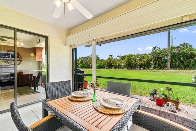 4260 Mango Tree Ct Unit B, Boynton Beach, FL 33436 - sunroom with a ceiling fan and outdoor dining space