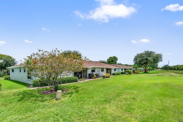 4260 Mango Tree Ct Unit B, Boynton Beach, FL 33436 - back of house featuring a lawn