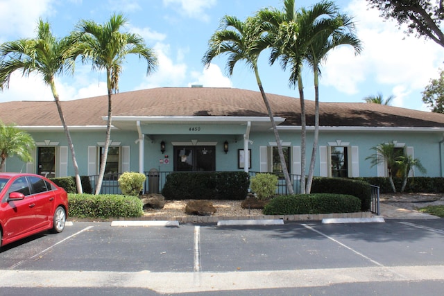 4260 Mango Tree Ct Unit B, Boynton Beach, FL 33436 - view of building exterior with uncovered parking