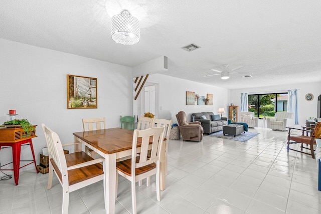 4260 Mango Tree Ct Unit B, Boynton Beach, FL 33436 - dining space with a textured ceiling, ceiling fan, and light tile patterned floors