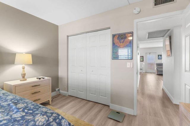4051 Guildford C Unit 4051, Boca Raton, FL 33434 - bedroom featuring light wood finished floors, baseboards, and a closet