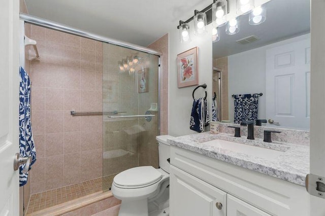 4051 Guildford C Unit 4051, Boca Raton, FL 33434 - bathroom with vanity, a stall shower, and toilet