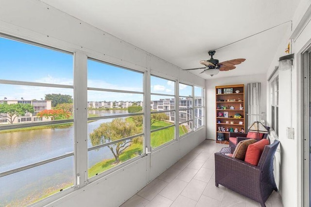 4051 Guildford C Unit 4051, Boca Raton, FL 33434 - sunroom featuring a water view, ceiling fan, and tile patterned flooring