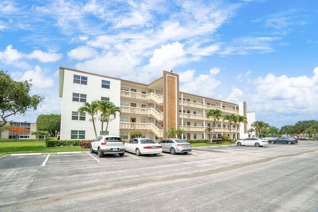 4051 Guildford C Unit 4051, Boca Raton, FL 33434 - view of apartment building / complex with uncovered parking