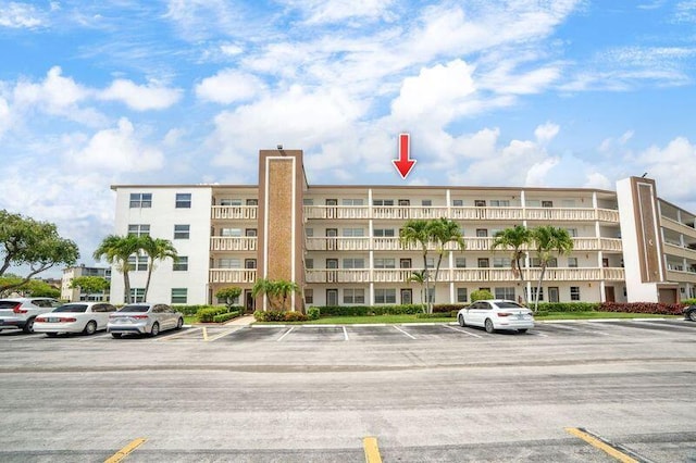 4051 Guildford C Unit 4051, Boca Raton, FL 33434 - view of apartment building / complex with uncovered parking