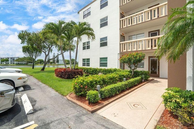 4051 Guildford C Unit 4051, Boca Raton, FL 33434 - view of apartment building / complex featuring uncovered parking