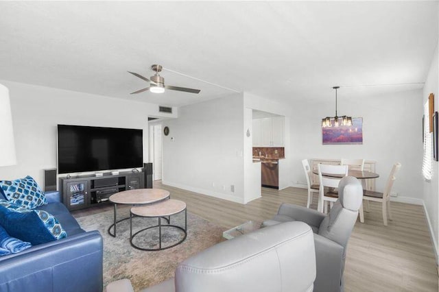 4051 Guildford C Unit 4051, Boca Raton, FL 33434 - living area featuring wood finished floors, baseboards, a chandelier, and a ceiling fan