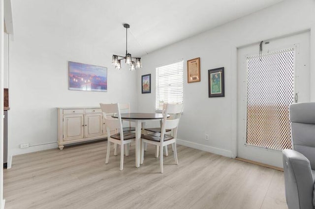 4051 Guildford C Unit 4051, Boca Raton, FL 33434 - dining area with light wood finished floors, a chandelier, and baseboards