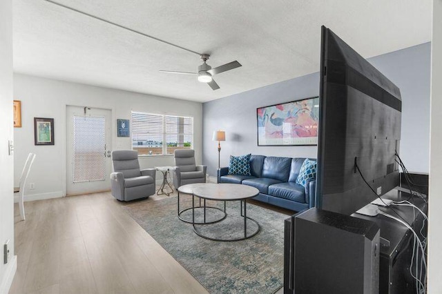 4051 Guildford C Unit 4051, Boca Raton, FL 33434 - living area with wood finished floors, a ceiling fan, and baseboards