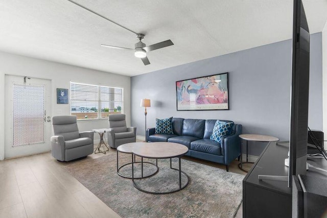 4051 Guildford C Unit 4051, Boca Raton, FL 33434 - living area featuring a ceiling fan, wood finished floors, and a textured ceiling
