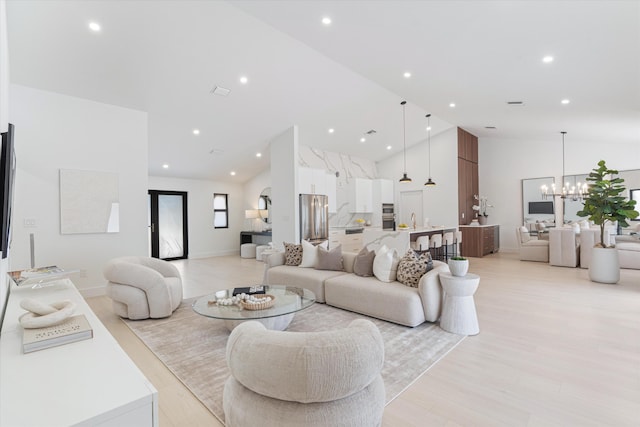 3099 NW 25th Way, Boca Raton, FL 33434 - living area featuring a chandelier, light wood-style flooring, high vaulted ceiling, and recessed lighting