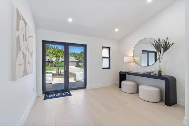 3099 NW 25th Way, Boca Raton, FL 33434 - doorway with recessed lighting, wood finished floors, and lofted ceiling