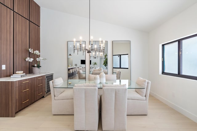 3099 NW 25th Way, Boca Raton, FL 33434 - dining room with wine cooler, a chandelier, light wood-type flooring, and lofted ceiling