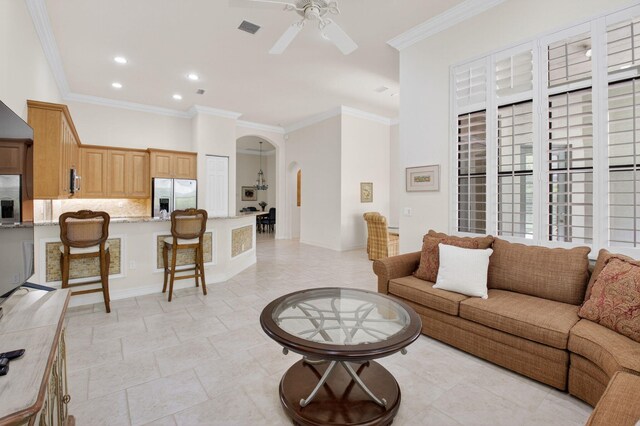 7030 Boscanni Dr Unit 7030, Boynton Beach, FL 33437 - living room with arched walkways, a ceiling fan, crown molding, and recessed lighting