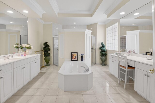 7030 Boscanni Dr Unit 7030, Boynton Beach, FL 33437 - bathroom with ornamental molding, a shower stall, a garden tub, two vanities, and a tray ceiling