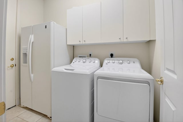 7030 Boscanni Dr Unit 7030, Boynton Beach, FL 33437 - laundry area with cabinet space, washer and clothes dryer, and light tile patterned floors