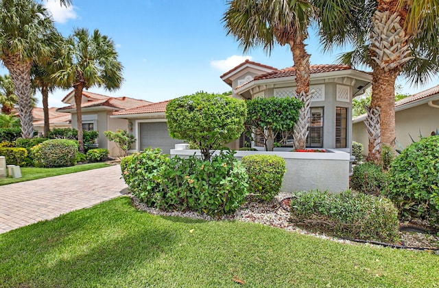 7030 Boscanni Dr Unit 7030, Boynton Beach, FL 33437 - mediterranean / spanish-style house with an attached garage, stucco siding, a front lawn, and a tile roof