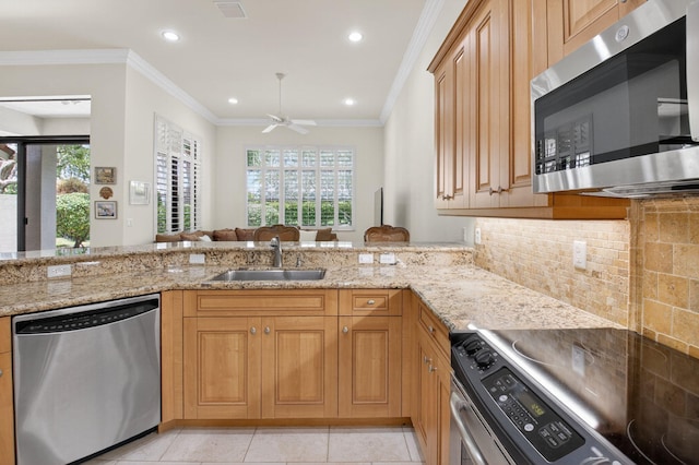 7030 Boscanni Dr Unit 7030, Boynton Beach, FL 33437 - kitchen featuring appliances with stainless steel finishes, a sink, light stone counters, ceiling fan, and healthy amount of natural light