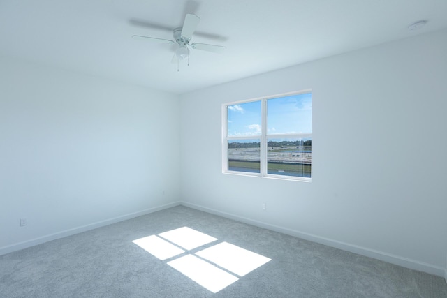242 SE Woodbark St, Port Saint Lucie, FL 34984 - carpeted empty room featuring baseboards, ceiling fan, and a smoke detector