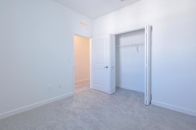 242 SE Woodbark St, Port Saint Lucie, FL 34984 - unfurnished bedroom with carpet floors, baseboards, and a closet