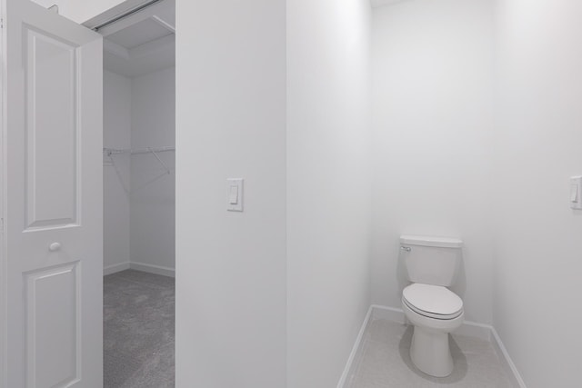 242 SE Woodbark St, Port Saint Lucie, FL 34984 - bathroom with toilet and baseboards