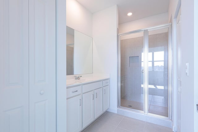 242 SE Woodbark St, Port Saint Lucie, FL 34984 - full bath featuring vanity, a shower stall, and tile patterned flooring