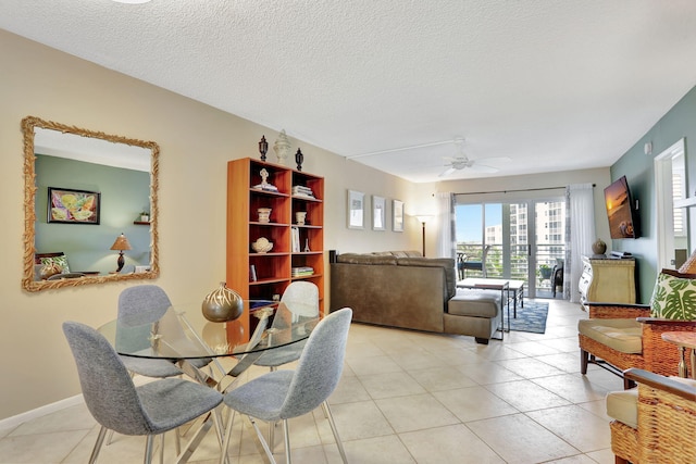 2731 NE 14th Cswy Unit 702, Pompano Beach, FL 33062 - dining space with ceiling fan, light tile patterned floors, and a textured ceiling