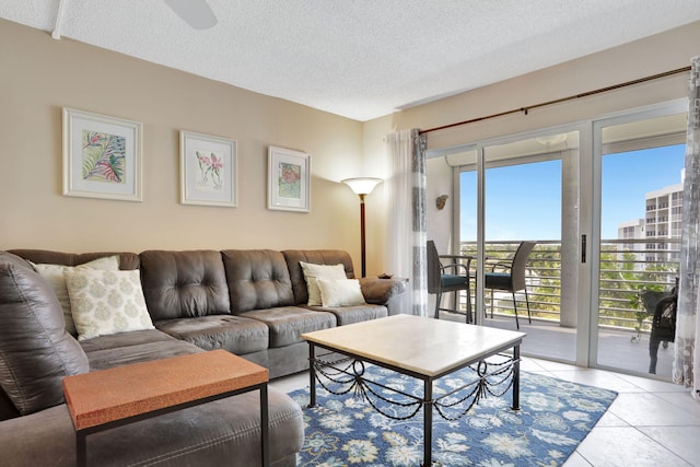 2731 NE 14th Cswy Unit 702, Pompano Beach, FL 33062 - living area with a textured ceiling, light tile patterned floors, and ceiling fan