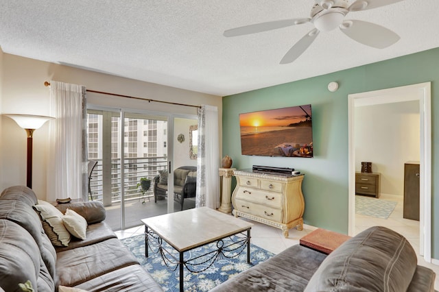 2731 NE 14th Cswy Unit 702, Pompano Beach, FL 33062 - living area with a textured ceiling, a ceiling fan, and light tile patterned flooring