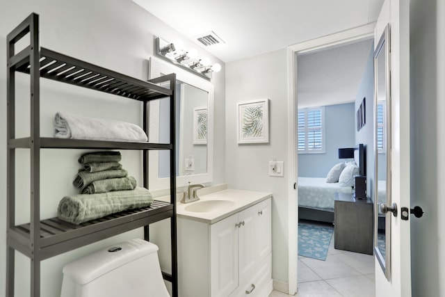 2731 NE 14th Cswy Unit 702, Pompano Beach, FL 33062 - bathroom with vanity, connected bathroom, tile patterned floors, and toilet