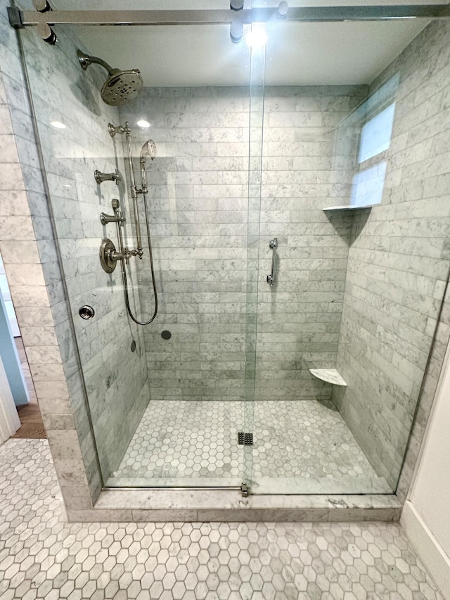 3 Colonial Club Dr Unit 104, Boynton Beach, FL 33435 - bathroom featuring a stall shower, tile patterned floors, and baseboards