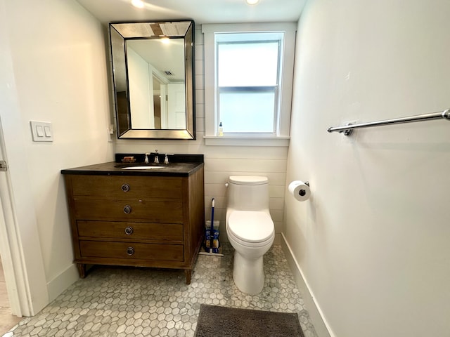 3 Colonial Club Dr Unit 104, Boynton Beach, FL 33435 - bathroom with vanity, toilet, and baseboards