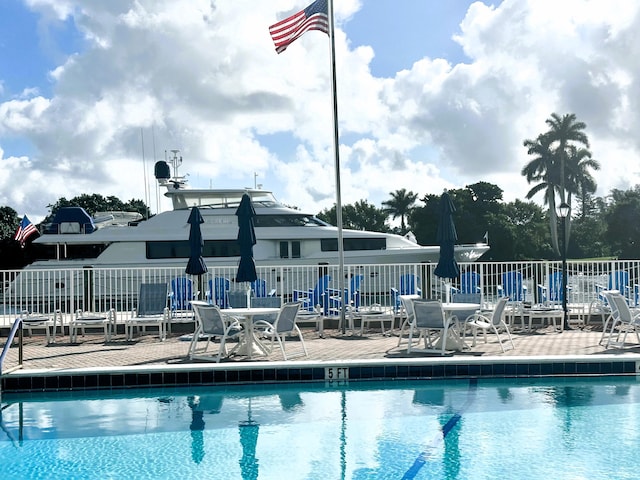 3 Colonial Club Dr Unit 104, Boynton Beach, FL 33435 - community pool featuring a patio