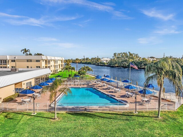 3 Colonial Club Dr Unit 104, Boynton Beach, FL 33435 - community pool featuring a patio and a water view