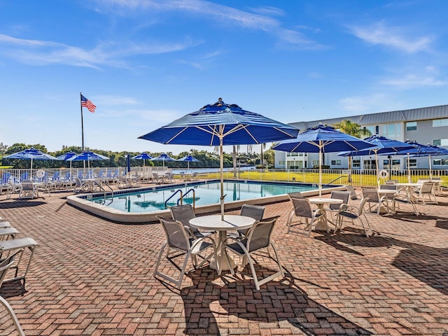 3 Colonial Club Dr Unit 104, Boynton Beach, FL 33435 - community pool with a patio
