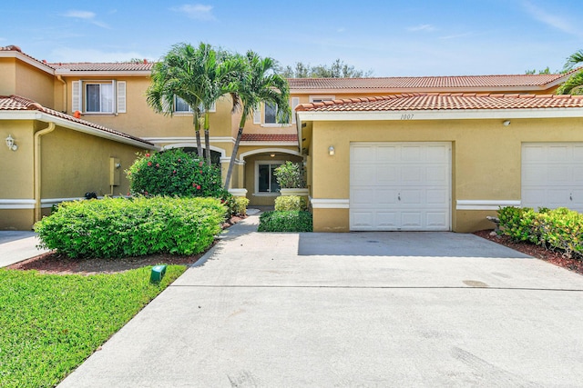 1007 Arezzo Cir, Boynton Beach, FL 33436 - view of front of home with a tiled roof, concrete driveway, and stucco siding
