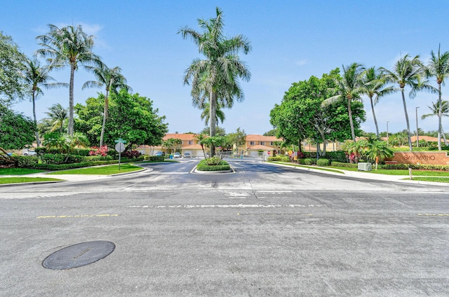 1007 Arezzo Cir, Boynton Beach, FL 33436 - view of asphalt street with curbs, traffic signs, and sidewalks