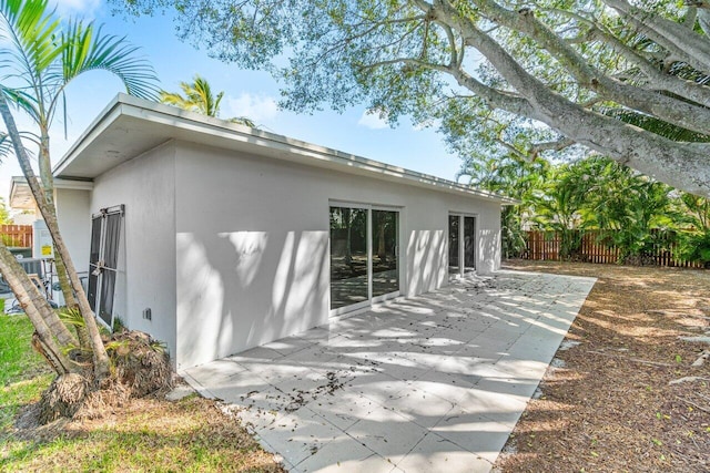 1188 W Camino Real, Boca Raton, FL 33486 - rear view of property featuring a patio area and stucco siding