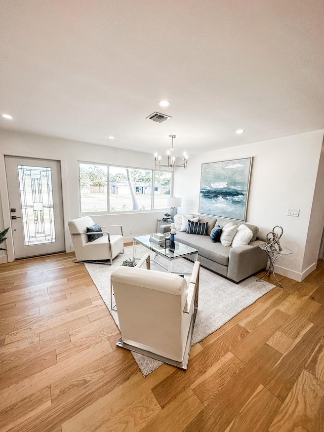 1188 W Camino Real, Boca Raton, FL 33486 - living area featuring a chandelier, light wood-style floors, recessed lighting, and baseboards