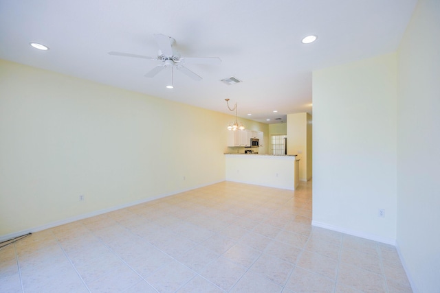 5441 Via Delray Unit 17, Delray Beach, FL 33484 - unfurnished living room with a chandelier, ceiling fan, recessed lighting, light tile patterned floors, and baseboards